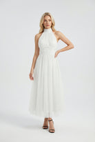 Elegant white midi dress by Lumina Wear featuring a flattering silhouette, perfect for women’s stylish occasions.