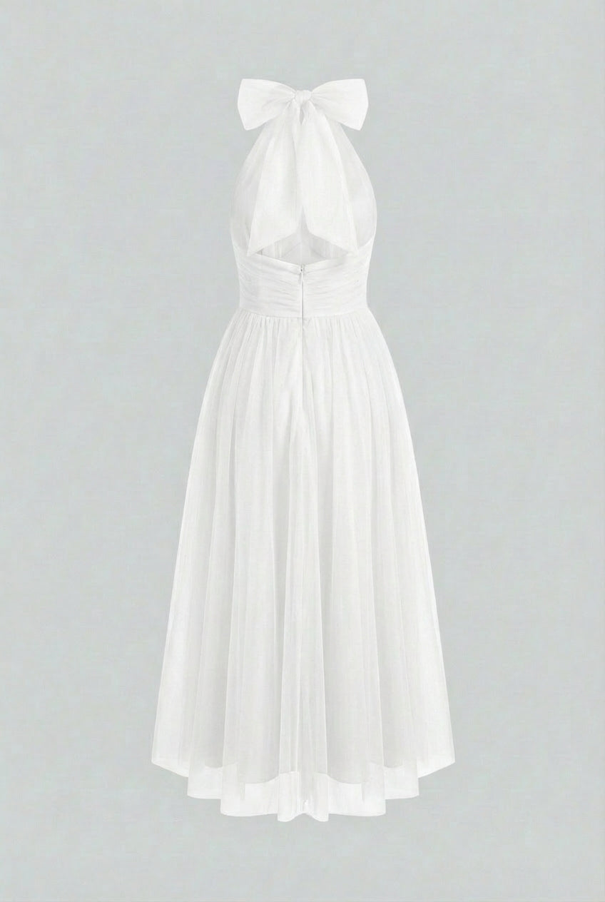 Elegant white midi dress by Lumina Wear featuring a flattering silhouette, perfect for women’s stylish occasions.