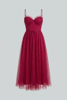Elegant wine red midi dress by Lumina Wear, featuring a versatile cut and feminine silhouette for women.