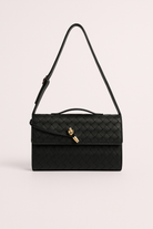 Elegant woven brown handbag from Lumina Wear featuring an adjustable strap and stylish design.