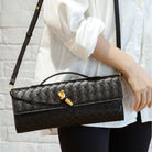 Elegant woven brown handbag with adjustable strap by Lumina Wear, featuring a stylish design and versatile carrying options.