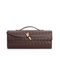 Elegant woven brown Lumina Wear Isabella handbag with adjustable strap, showcasing stylish craftsmanship and versatile design.