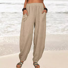 Isabella Lumina black high-waisted harem trousers with casual fit, front pockets and relaxed style, shown on white background.