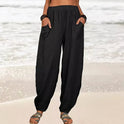 Isabella Lumina high-waisted black harem trousers with a casual fit, featuring loose, comfortable fabric and relaxed style.