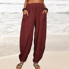 Isabella high-waisted black harem trousers by Lumina Wear with a casual fit and relaxed style, shown in a white background image.
