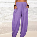 Isabella Lumina Wear high-waisted black harem trousers with casual fit, featuring relaxed style and lightweight fabric.