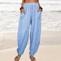 Isabella Lumina black high-waisted harem trousers with a casual fit, displayed on a model with a relaxed pose.