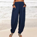 Isabella Lumina high-waisted black harem trousers with casual fit, featuring relaxed fabric and stylish design.