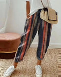 Lightweight, breathable grey linen trousers from Lumina Wear, styled with a relaxed fit and subtle multicolor details.