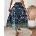 Lightweight floral maxi skirt with layered design from Lumina Wear, featuring green fabric and flowing silhouette.