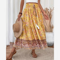 Lightweight floral maxi skirt with layered design from Lumina Wear, featuring green fabric and flowing silhouette.