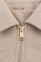 Beige Isabella Lumina Wear modern cropped zip-up jacket with pockets, featuring a stylish and casual design.