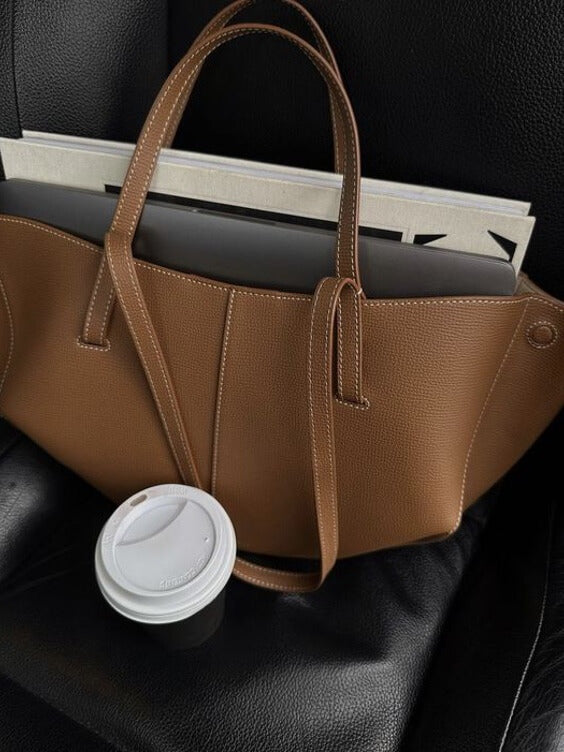 Brown oversized vintage handbag with versatile straps from Lumina Wear, featuring detailed stitching and spacious interior.