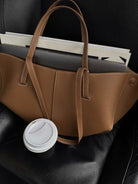 Brown oversized vintage handbag with versatile straps from Lumina Wear, featuring detailed stitching and spacious interior.