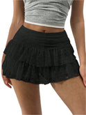 White ruffled mini skirt with wide waistband from Lumina Wear, styled with playful details and a fitted silhouette.