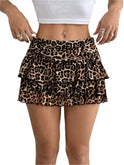 White ruffled mini skirt with wide waistband from Lumina Wear, featuring playful design and lightweight fabric.