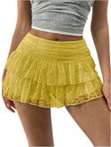 White ruffled mini skirt with wide waistband from Lumina Wear, featuring playful design and fitted style.