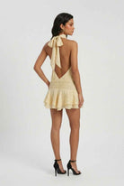 Yellow mini dress with playful design and feminine fit from Lumina Wear, perfect for casual occasions.