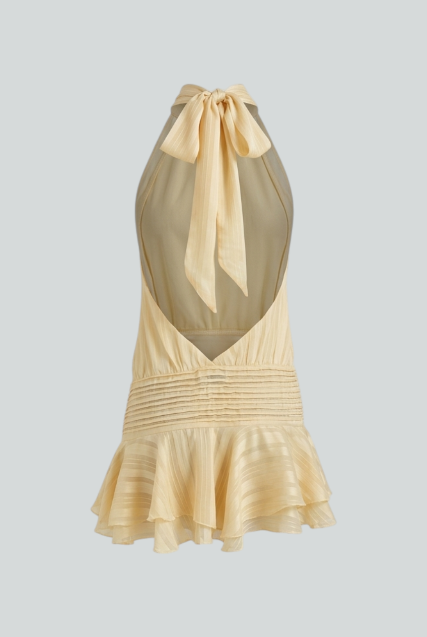 Isabella Lumina yellow mini dress with playful fit, casual style, feminine silhouette, worn by a model in a bright outdoor setting.