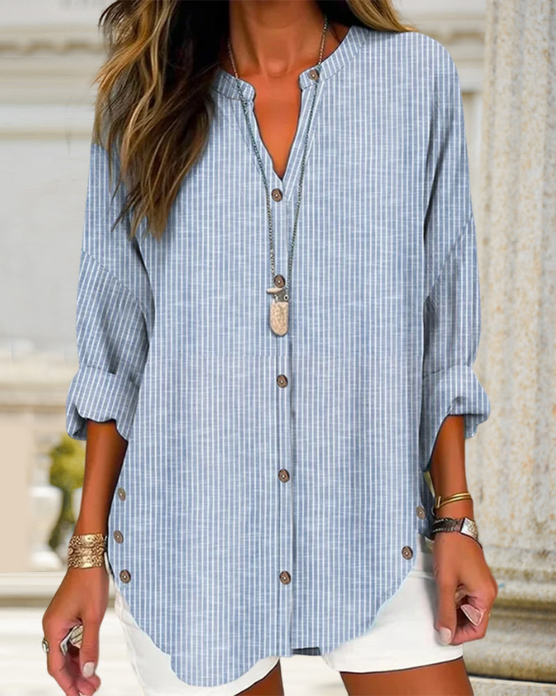 Blue Isabella relaxed striped blouse with button front by Lumina Wear, shown on a model. Stylish and casual women's blouse.