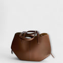 Lumina Wear Isabella minimalist tote bag in brown with sculpted design and spacious interior, measuring 32x13x22cm.