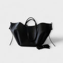 Lumina Wear Isabella minimalist tote bag in brown with sculpted design, spacious interior, measuring 32x13x22cm.