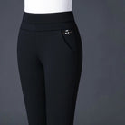 Lumina Wear Isabella high waist black leggings with faux pockets, showing a close-up of sleek, stretchy fabric and stylish fit.