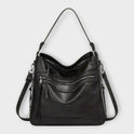 Isabella black slouchy shoulder handbag with versatile straps by Lumina Wear, featuring a soft, slouchy design and adjustable strap details.