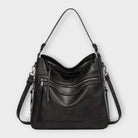 Black Isabella Lumina Wear slouchy shoulder handbag with versatile straps, featuring a spacious interior and stylish design.