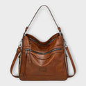 Lumina Wear Isabella slouchy black shoulder bag with versatile straps, featuring a spacious design and stylish look.