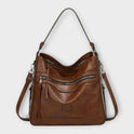 Black Lumina Wear Isabella slouchy shoulder handbag with versatile straps, featuring a stylish and spacious design.