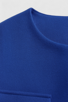 Blue winter jacket by Lumina Wear, Isabella style, featuring versatile design and stylish details, perfect for cold weather.
