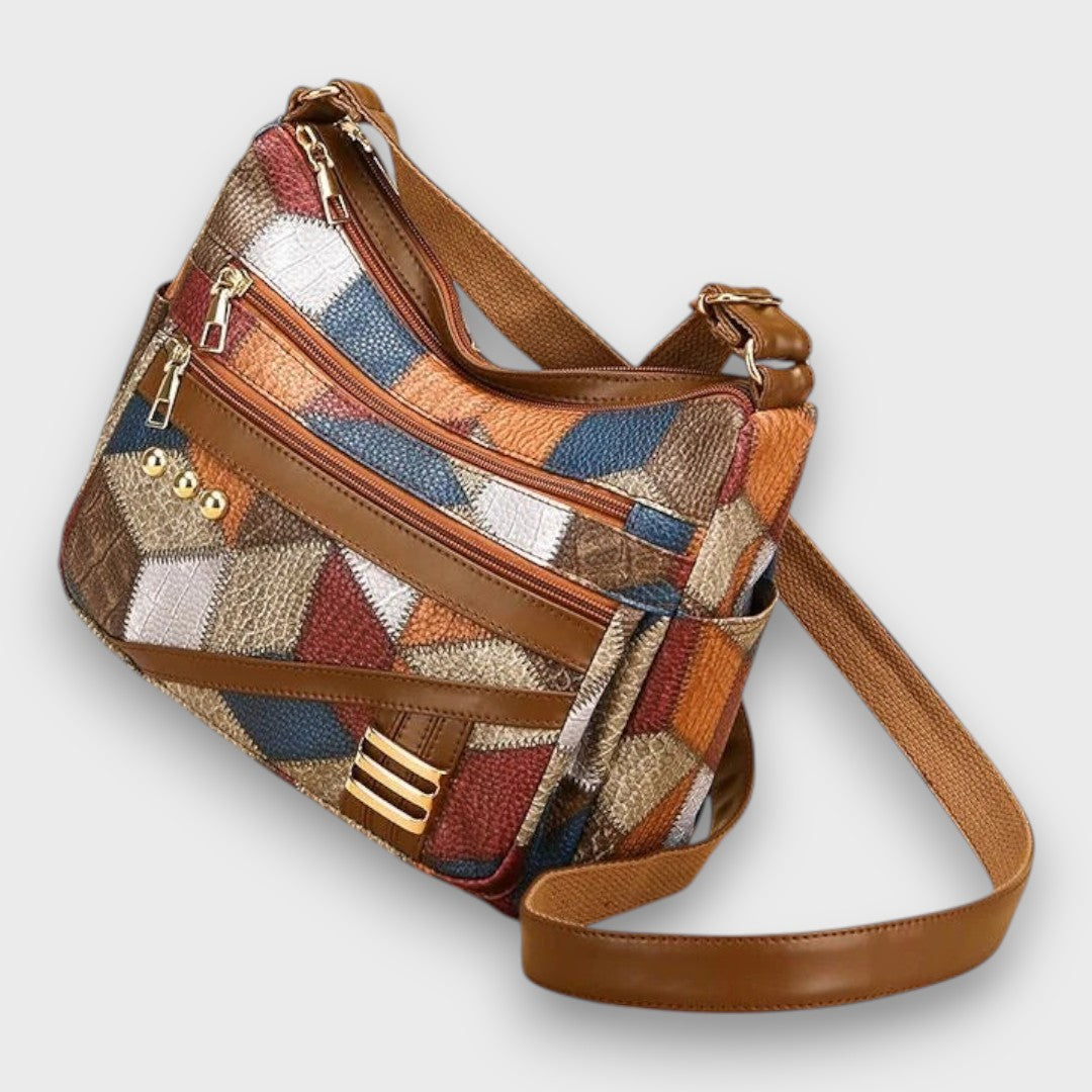 Isabella textured patchwork shoulder bag by Lumina Wear with faux-leather accents, featuring a stylish and functional handbag design.