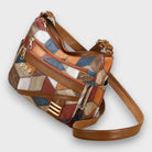 Isabella textured patchwork shoulder bag by Lumina Wear with faux-leather accents, featuring a stylish and functional handbag design.