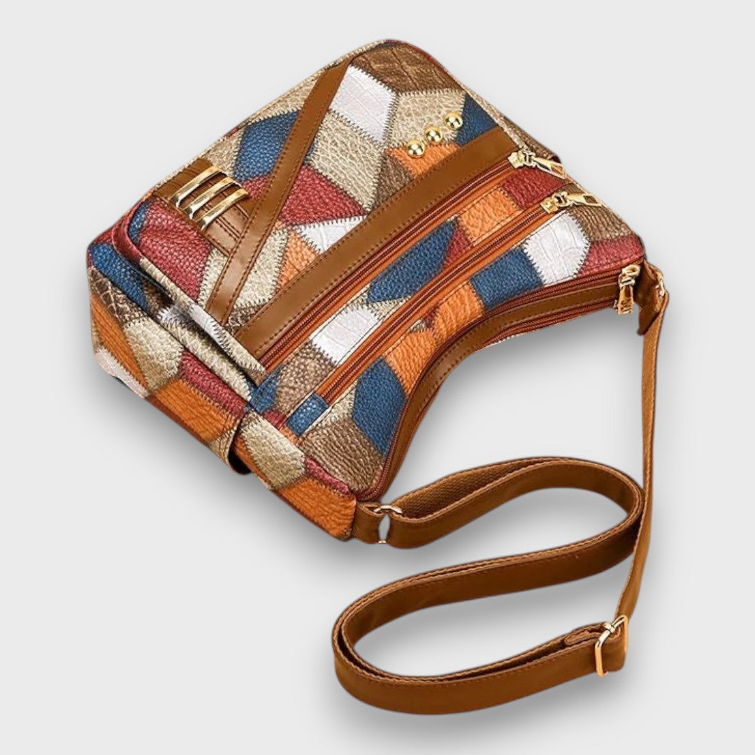 Isabella textured patchwork shoulder bag with faux-leather accents from Lumina Wear, featuring a stylish design and shoulder strap.