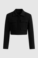 Black Isabella Lumina Wear cropped jacket with a trendy, tailored fit for women, styled with a sleek collar and zip closure.