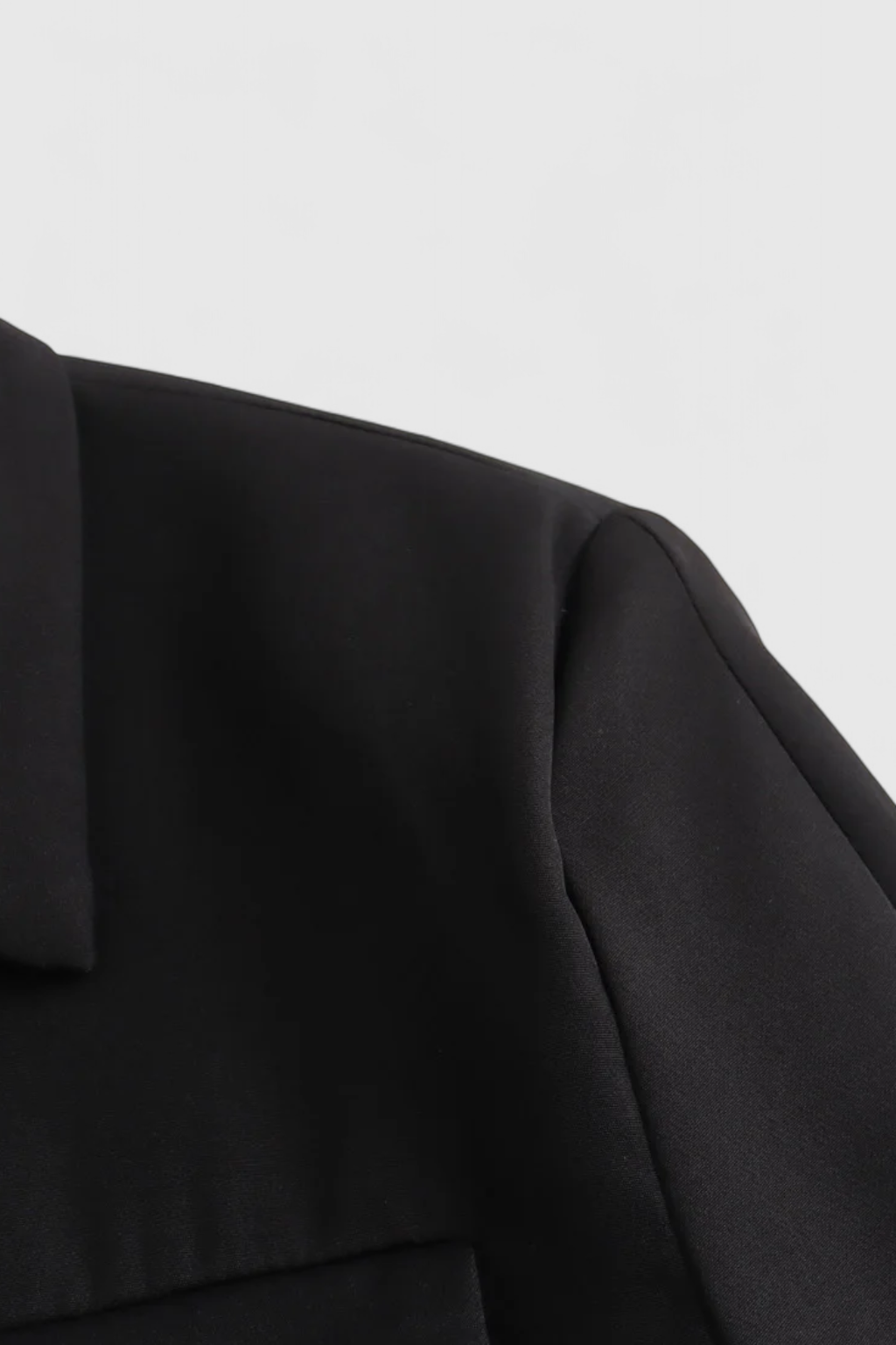 Black Isabella women's cropped jacket by Lumina Wear featuring a trendy, tailored fit and stylish design.