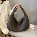 Beige Isabella Lumina woven eco-leather shoulder handbag with unique design and hand-stitched details, stylish and eco-friendly.