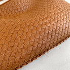 Beige Isabella woven eco-leather shoulder bag by Lumina Wear, featuring a unique handcrafted design and spacious interior.