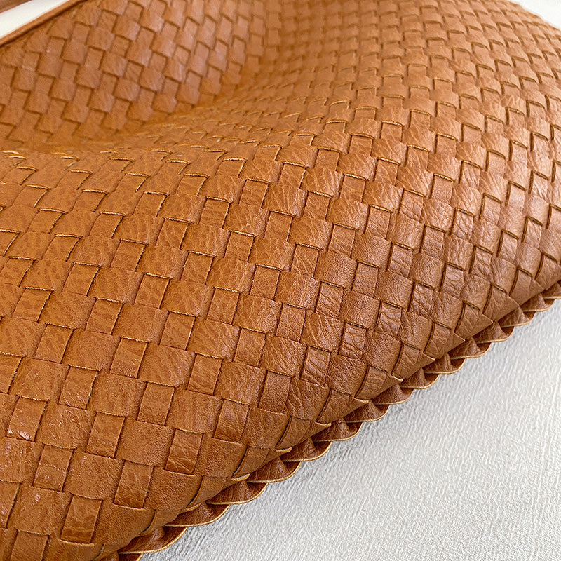 Beige Isabella woven eco-leather shoulder bag by Lumina Wear, featuring a unique handcrafted design and spacious interior.