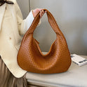 Beige Isabella woven eco-leather shoulder handbag by Lumina Wear, featuring a unique handcrafted design and spacious interior.