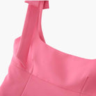 Vibrant pink Lumina Wear Isabella cami top with playful bow detail, sleeveless tank, stylish and feminine for casual wear.