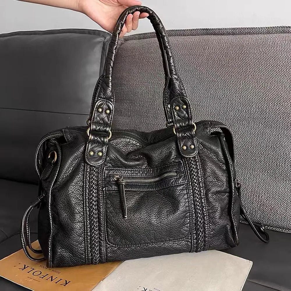 Lumina Wear Isabella vintage-inspired black handbag with spacious interior and elegant design, perfect for stylish everyday use.