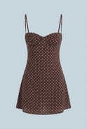 Vintage polka dot mini dress with ruffled hem by Lumina Wear, featuring a classic chocolate color and stylish design.