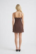 Isabella vintage polka dot mini dress by Lumina Wear with ruffled hem, chocolate color, and XS size, perfect for casual summer wear.
