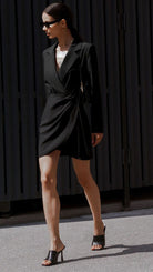 Isabelle black trench mini dress by Lumina Vancouver, showcasing a sleek classic black design with a fitted silhouette.