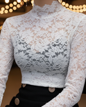 Black floral lace high neck blouse by Lumina Wear, featuring intricate lace details and a fitted silhouette.