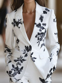Lumina Wear Sunniva floral printed blazer in white, featuring a tailored design and vibrant floral pattern, perfect for stylish outfits.