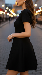 Black Isabelle high neck belted dress by Lumina Vancouver, displayed on a mannequin with a stylish silhouette.