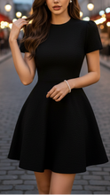 Black Isabelle high neck belted dress by Lumina Wear, shown on a model, with a fitted silhouette and elegant design.